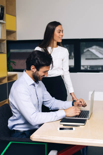 istock Young businessman working on laptop in modern office 1033172054