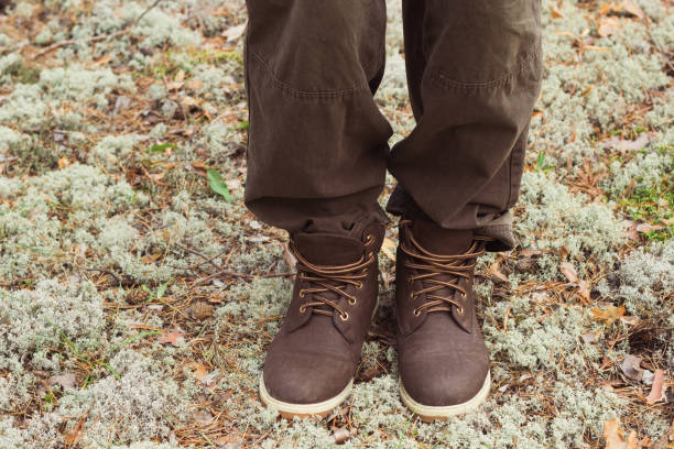 istock man traveler legs in leather boots 1033172412