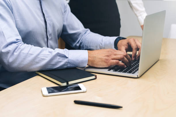 istock Young businessman working on laptop in modern office 1033172426