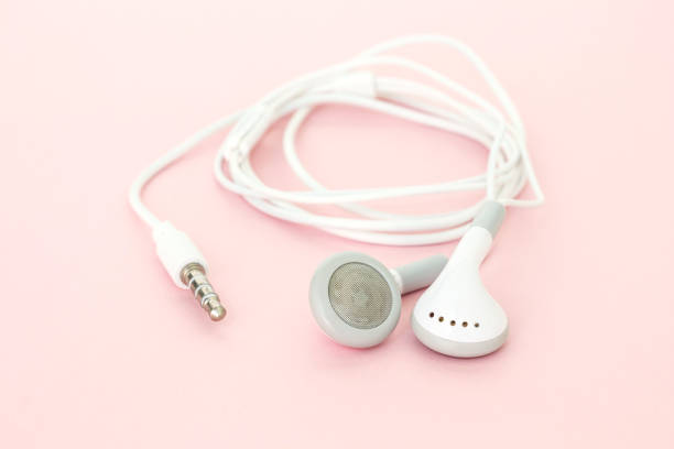istock earbuds or earphones on pink background 1033177858
