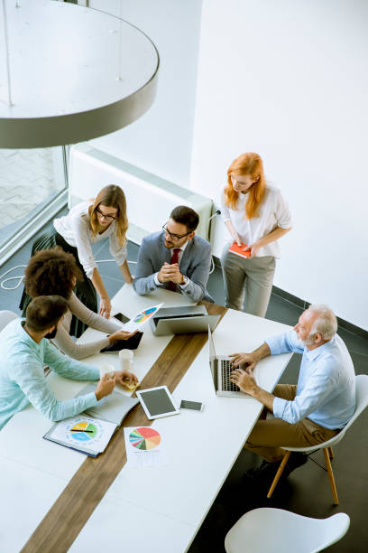 istock Top view at business people in office 1033178010