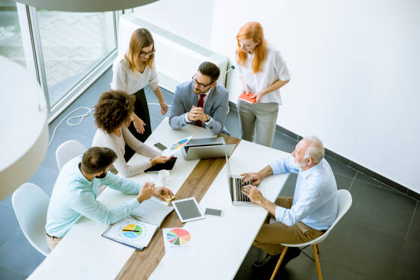 istock Top view at business people in office 1033178018