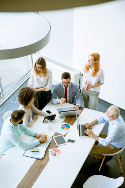 istock Top view at business people in office 1033178064