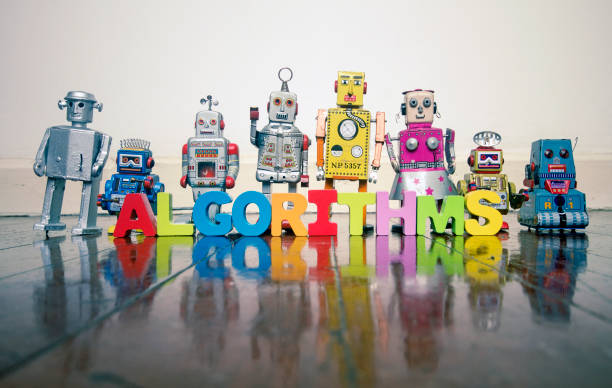 istock ALGORITHMS  wooden letters and retro robot toys 1033180676