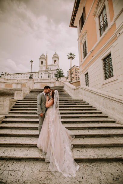 istock Young wedding couple on Spanish stairs in Rome 1033183634