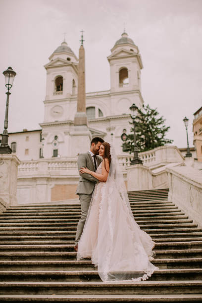 istock Young wedding couple on Spanish stairs in Rome 1033183662