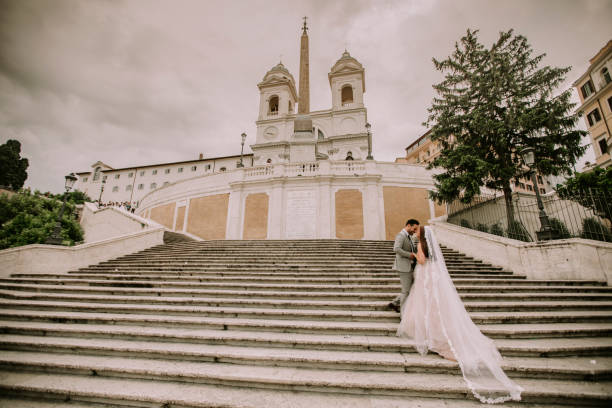 istock Young wedding couple on Spanish stairs in Rome 1033183674