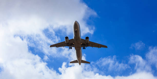 istock Airplane in a blue sky 1033189866