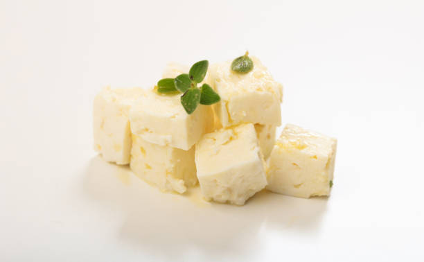 istock Greek feta cheese pieces on white background 1033192174