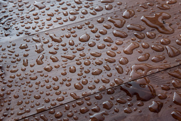 istock water drops on wooden board 1033194564