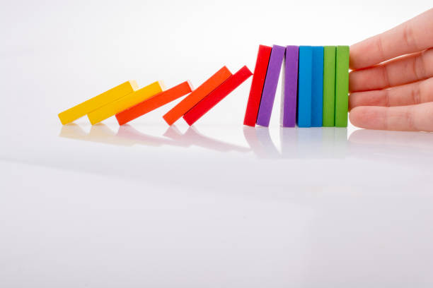istock Hand holding color dominoes 1033198260