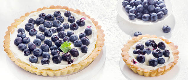 Sweet Cakes with blueberries, mint and whipped cream.