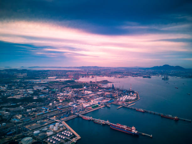 Aerial view of dalian port Aerial view of shipping containers, cranes and storage tanks in dalian,china. shenyang stock pictures, royalty-free photos & images
