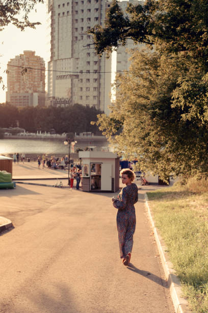 istock Woman walking along the road 1033217024