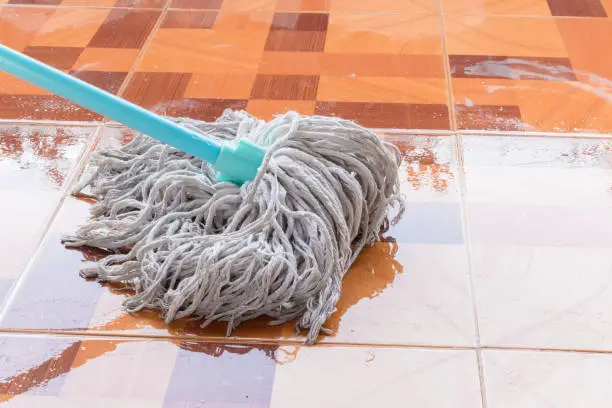 Mop the tile floor in home