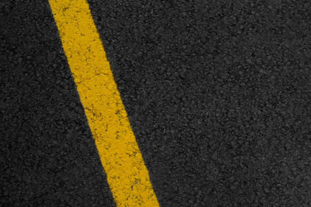 istock Asphalt texture with yellow striped 1033223088