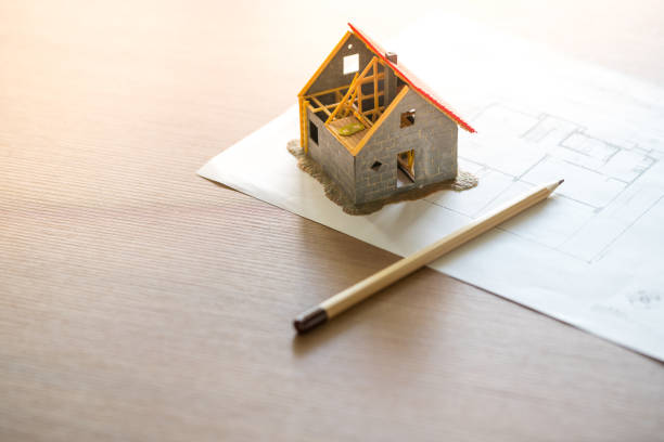 istock Home & housing estate concept with blueprint 1033223548