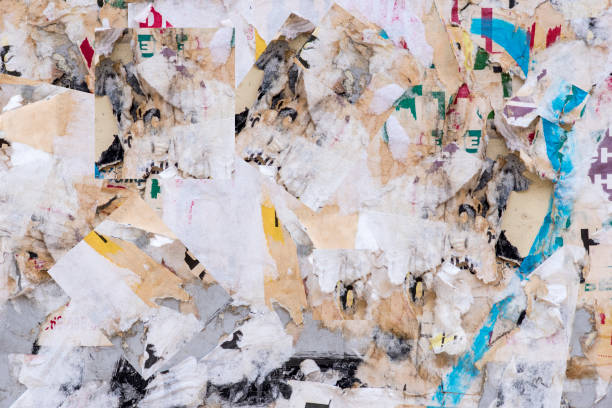 istock Colorful torn posters on grunge old wallsas background or texture, high resolution picture 1033229016