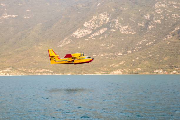 istock Water bomber firefighting plane over Garda Lake 1033234260