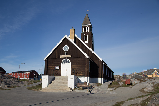 Ilulissat, Greenland - June 30, 2018: Exterior view of the old wooden Zion's Church, one of the northernmost churches in the world