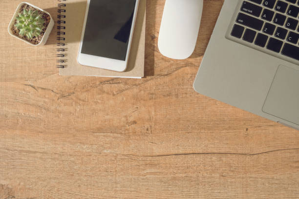 istock Wood desk table with supplies. Top view with copy space, flat lay. Morning work concept. 1033250204
