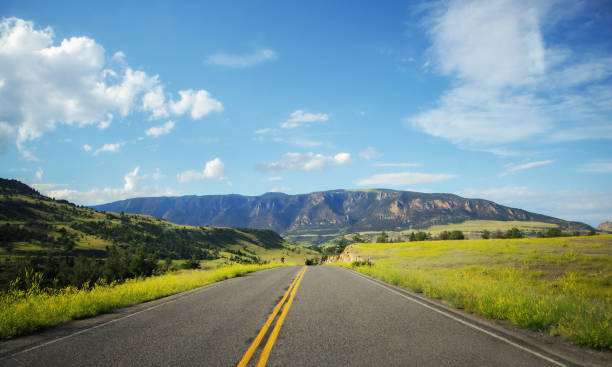 istock A highway cutting through a summertime Wyoming landscape 1033254012