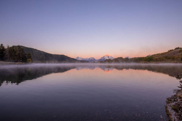 istock Sunrise Reflection in the Tetons in Autumn 1033260872