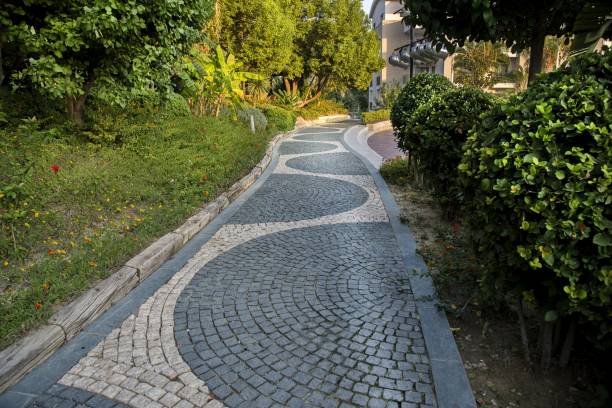 istock Cobblestone walk in the garden in summer 1033260922