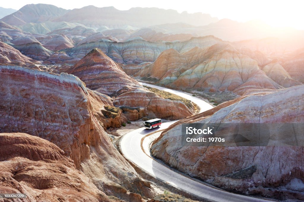 Tourists took the bus to see the beautiful scenery of Danxia landform  in the National Geopark of Zhangye, Gansu, China. Beauty Stock Photo