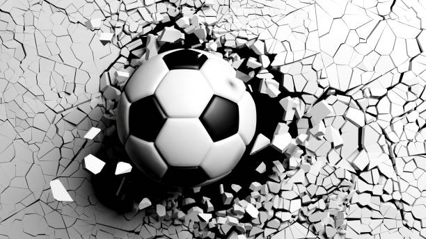 istock Soccer ball breaking forcibly through a white wall. 3d illustration. 1033270840