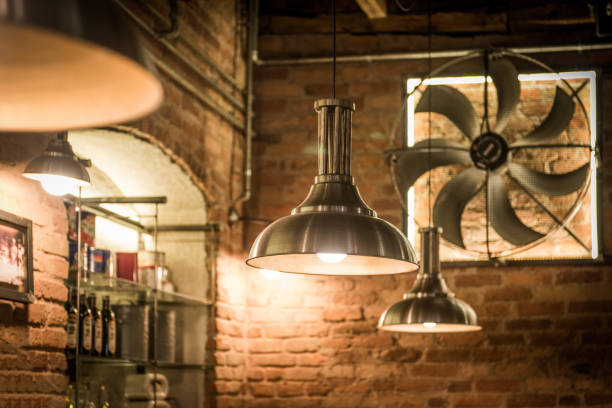 istock Ceiling lamp an fan in interior of restaurant 1033271286
