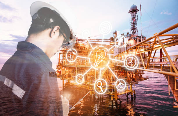 istock Double exposure of Engineer or Technician man with digital icon operated platform or plant by using tablet with offshore oil and gas platform background for industry business concept. 1033277442