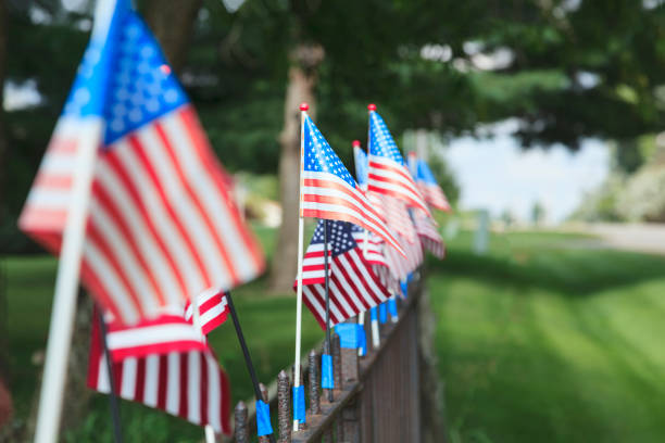 istock American flags on a fence 1033284434