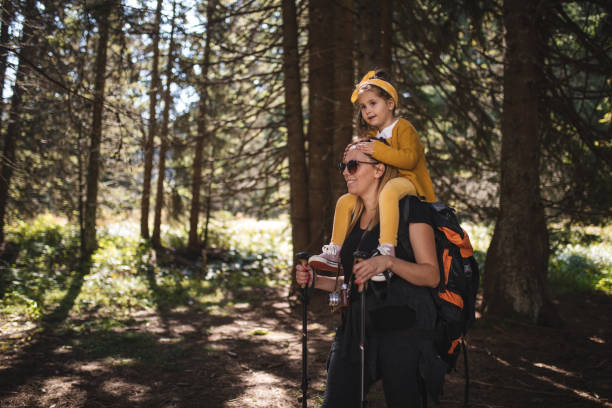 istock Mother carrying her daughter in nature 1033295300