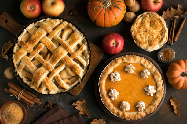 Thanksgiving pumpkin and apple various pies Thanksgiving pumpkin and apple various pies, top view, copy space. Fall traditional homemade apple and pumpkin pie for autumn holiday. sweet pie stock pictures, royalty-free photos & images