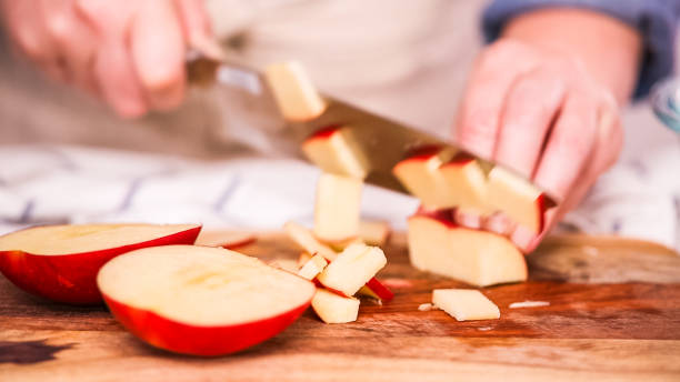istock Slicing red apples for filling to make empanadas. 1033298768