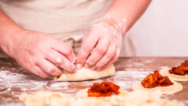 istock Making home made empanadas with red apples fillings. 1033298788
