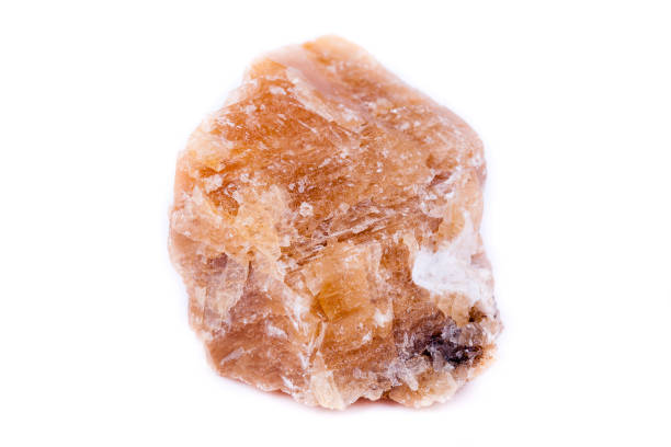 istock Macro mineral stone yellow calcite on a white background close up 1033299248