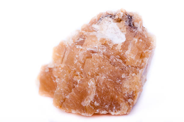 istock Macro mineral stone yellow calcite on a white background close up 1033299276