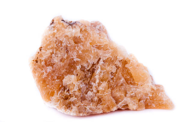 istock Macro mineral stone yellow calcite on a white background close up 1033299280