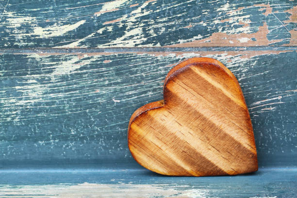 istock Wooden heart on rustic wooden surface with copy space 1033301698