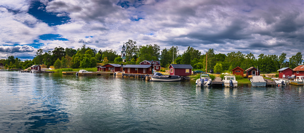 Swedish Archipelago - June 23, 2018: Panoramic view of a small coastal town in the island of Moja in the Swedish Archipelago during Midsummer, Sweden