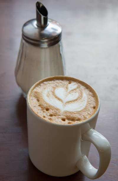 istock cappuccino coffee in cup and sugar bowl 1033307200