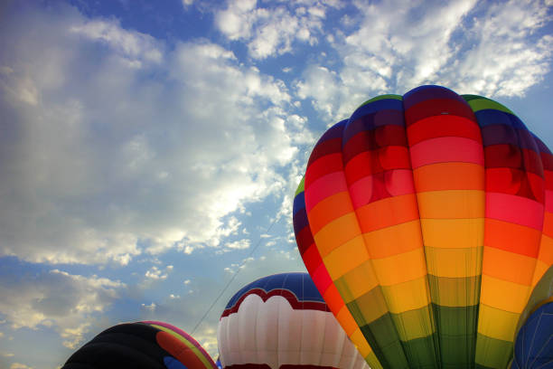 istock Hot air balloons preparing for launch 1033307954