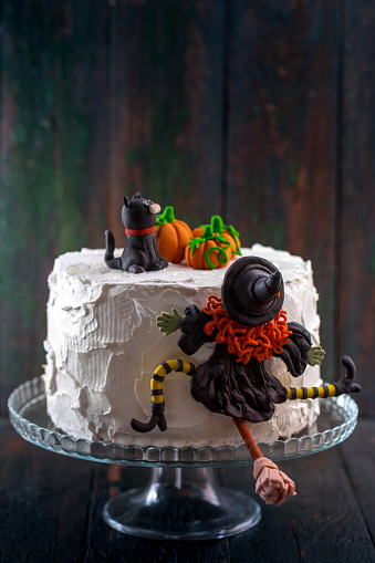 Cake with a witch and pumpkins for Halloween