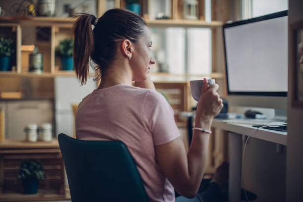 istock Cute lady working in home office 1033319144