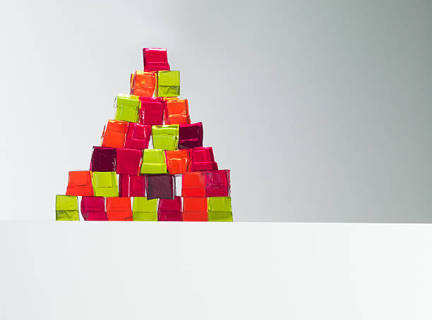 Pyramid of vibrant gelatin dessert cubes  gelatin dessert stock pictures, royalty-free photos & images
