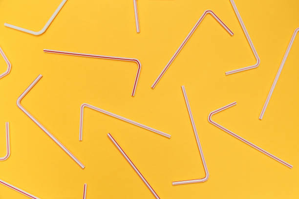 istock Drinking straws for party on yellow background. Top view 1033348622