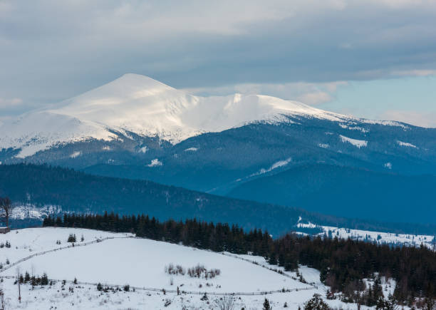 istock Evening winter cloudy day mountain ridge 1033348768