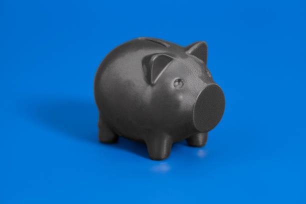 istock Piggy bank on blue background 1033354424